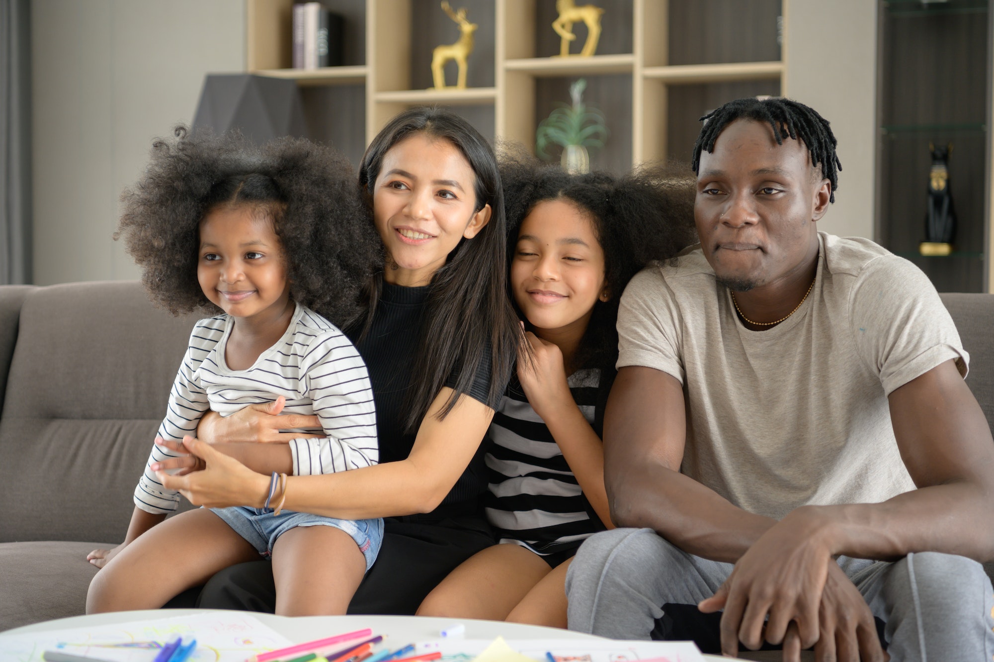 Asian-African American family relaxing,