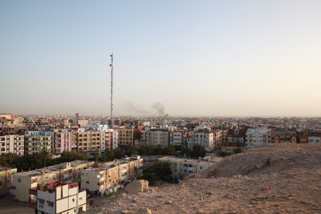 city ​​of Hurghada. Top view of the houses. Black smoke in the city